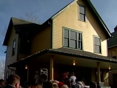 The house is of two floors as there are people queuing outside to visit.